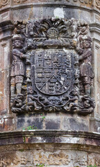 Shield carved in stone with the arms of Miera, Rubalcaba, Velasco, Riba and Agüero. Cruz de Rubalcaba in the town of Rubalcaba, Liérganes, Valles Pasiegos, Cantabria, Spain