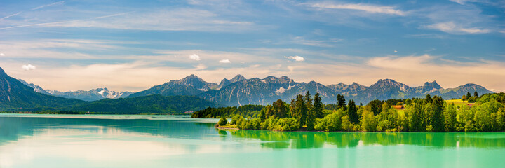 panoramic landscape in Bavaria with mountain range and lake