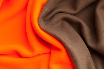 Background texture of bright orange and brown fleece