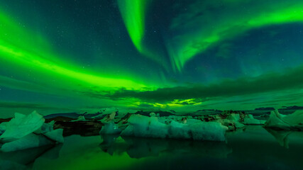 Aurora above Ice floe in glacier lake, Jökulsarlon, Iceland