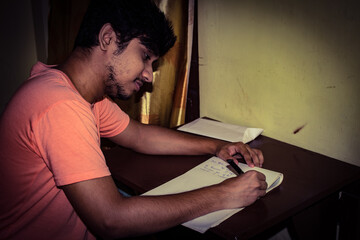 man writing a letter 