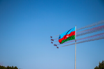 Turkish Falcons and Azerbaijan flag. Performance of the Turkish aerobatic team at the air show.