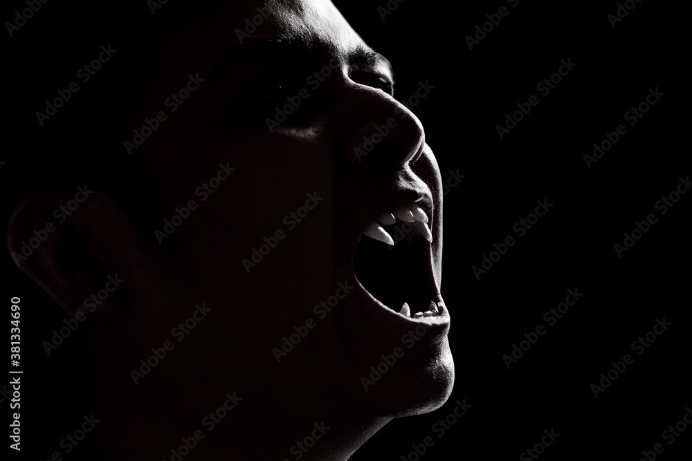 Wall mural scary vampire man on dark background