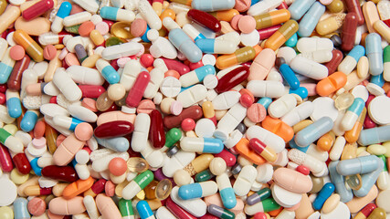 Fototapeta na wymiar medicines drugs background with colorful pills
