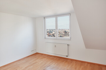 Empty room in attic apartment in Berlin