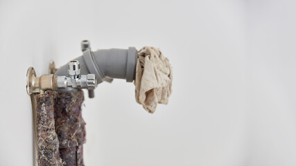 Pipe for drain and water connection in the wall of the kitchen