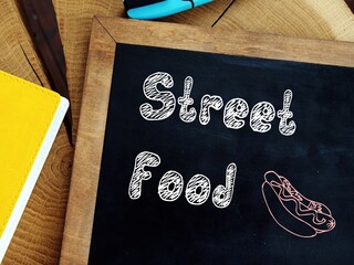 Financial concept meaning Street Food with inscription on the sheet.