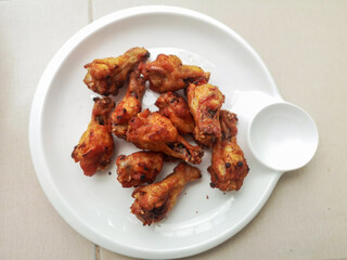 Fried chicken is a crispy and tasty on white dish.