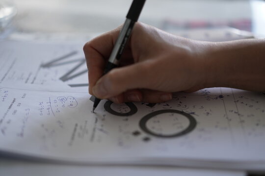 close up of a person solving question