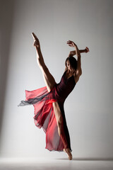 ballerina with a waving red dress