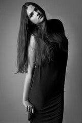 Naklejka premium tall girl black dress pose glamorous
