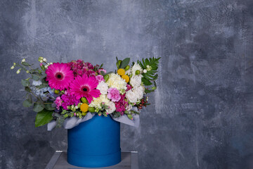 Beautiful bouquet of flowers on a gray concrete background. Copy space