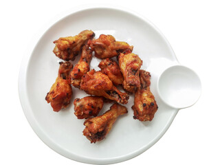 Fried chicken is a crispy and tasty on white dish isolate on white background.