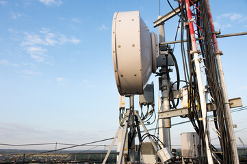Wireless Communication Directional Antenna With bright sky. Telecommunication tower with antennas...