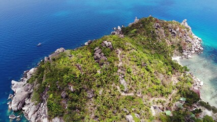Calm colorful azure turquoise sea near tiny tropical volcanic island Koh Tao, unique small paradise...