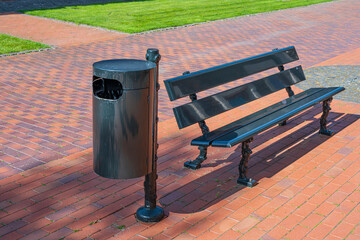 Trach can and bench in the city center.