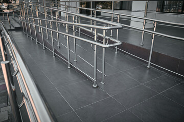 Ramp for people with disabilities and chrome railings