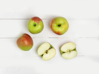 Apples on a white wooden table.