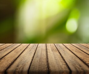 The empty wooden table top on nature background.