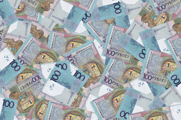 100 Belorussian rubles bills lies in big pile. Rich life conceptual background