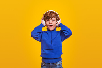 Shocked boy listening to music