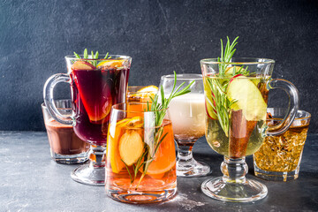 Various autumn winter alcohol drinks set. Different seasonal alcohol cocktails - mulled wine, glogg, grog, eggnog, ginger ale, hot buttered rum, punch, apple cider, sangria, white background