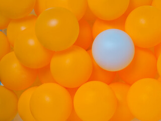 Orange and white table tennis balls Mixed colors, full background