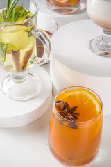 Various autumn winter alcohol drinks set. Different seasonal alcohol cocktails - mulled wine, glogg, grog, eggnog, ginger ale, hot buttered rum, punch, apple cider, sangria, white background