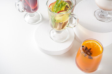 Various autumn winter alcohol drinks set. Different seasonal alcohol cocktails - mulled wine, glogg, grog, eggnog, ginger ale, hot buttered rum, punch, apple cider, sangria, white background