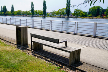 Vichy city docks in Allier river with modern wooden bench in Auvergne France - Powered by Adobe