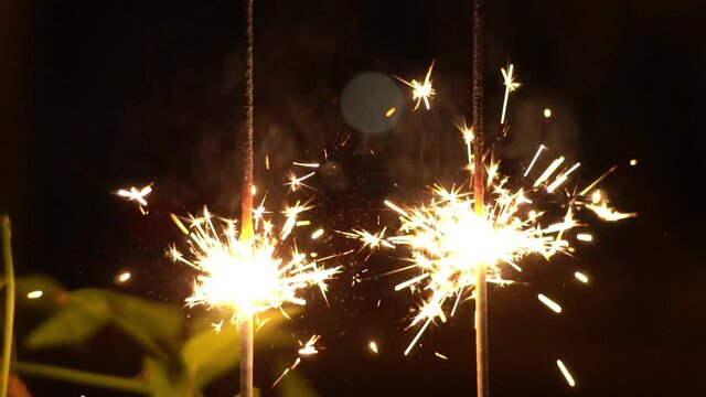 Fire crackers in slow motion, fireworks in slow motion.