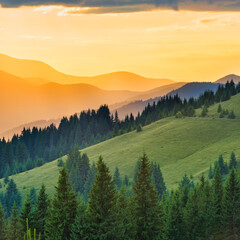 Fototapeta na wymiar Beautiful sunset in the mountains. Landscape with sun shining through orange clouds