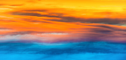 Fototapeta na wymiar Sunset dramatic sky panorama with colorful clouds as nature sunset background