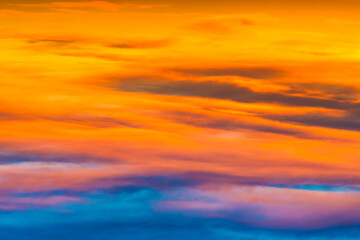 Naklejka na ściany i meble Sunset dramatic sky with colorful clouds as nature sunset background