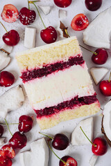 Slice of cake in the section on the background of fruit