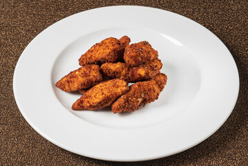 chicken nuggets on the white plate