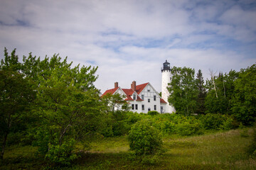 Fototapeta premium Point Iroquois Lighthouse. The Point Iroquois Lighthouse is located on the coast of Lake Superior and part of the Hiawatha National Forest in the Upper Peninsula of Michigan. 