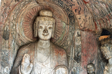 Longmen Grottoes with Buddha's figures are Starting with the Northern Wei Dynasty in 493 AD. It is one of the four notable grottoes in China.