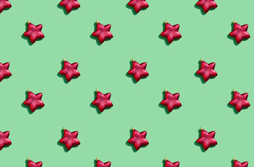 Minimal pattern background of red star on green background . New Year concept. flat lay top view 