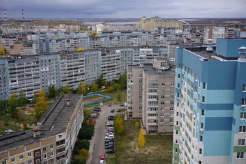 Metropolis. Large apartment buildings in the city by the river.