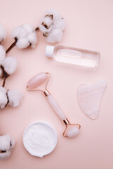Selfcare, relaxation and beauty care concept. Modern apothecary or home spa composition on pink background