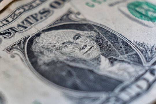 The United States one-dollar bill with An image of the first U.S. President George Washington portrait close up