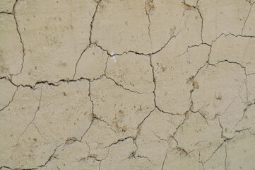 a crack on the wall covered with clay