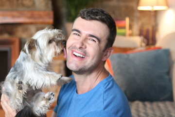 Dog welcoming owner with a kiss
