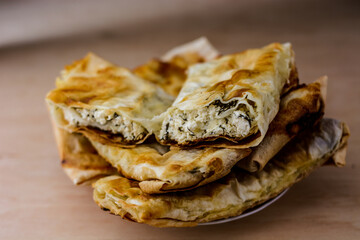 homemade lavash with cottage cheese on wooden table