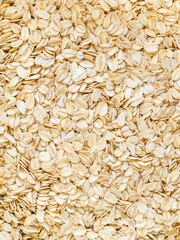 uncooked oatmeal close up - background, healthy food