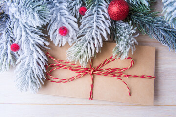 Envelope and frosty Christmas tree branches with decoration. Xmas and New Year concept