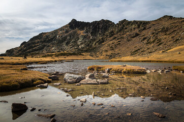 Lake on a rocky mountain landscape on Guadarrama mountain range, Peñalara, Madrid, Spain
