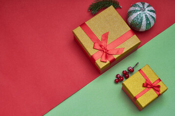 Gifts boxes, Christmas decorations on green and red paper background. Trendy photo. New year ,christmas concept