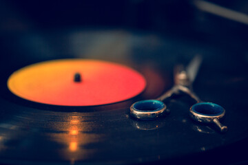 Close up of scissors on vinyl record. Barber shop.
